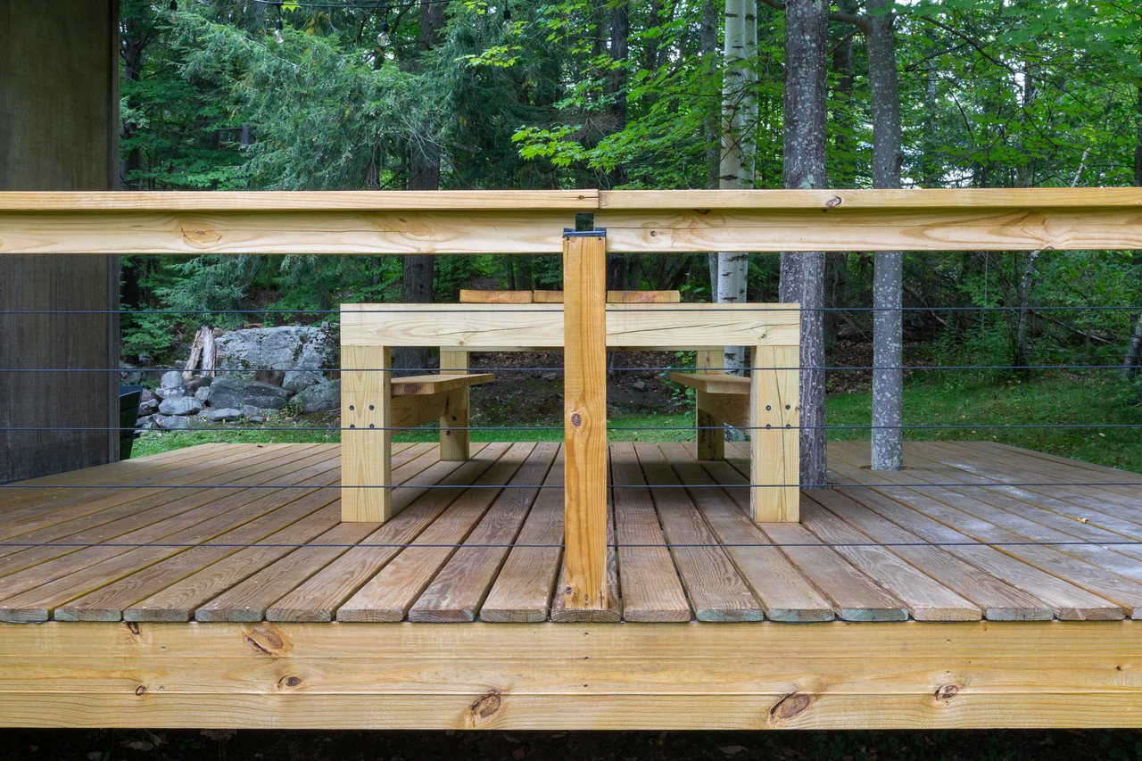 Outdoor dining table overlooking the forest